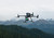 A DJI Matrice drone in flight utilizing the Zenmuse L2 LiDAR for professional 3D mapping and infrastructure inspection across diverse terrain.