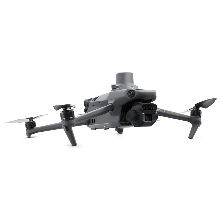 Side profile view of the DJI Mavic 3 Multispectral drone in flight, showing the integrated RTK module and compact foldable design for precision agriculture.