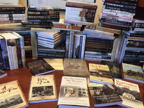 How many books on the account manager's desk?