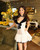 Elegant White Lace Dress With Black Velvet Trim Bow Detail Flirty Feminine Design Perfect For Special Occasions Evening  Wear