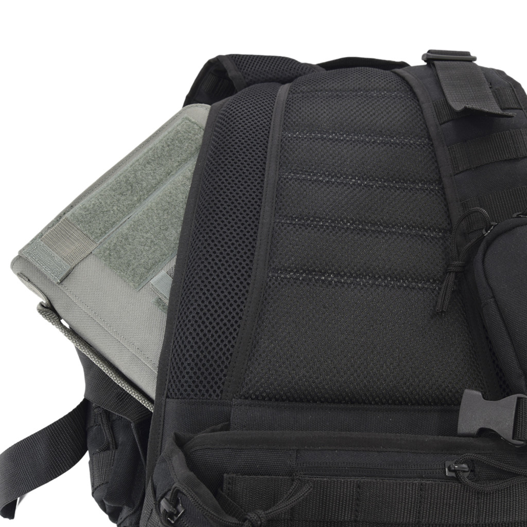 Hidden “pass through” backside pocket can accommodate tablets.  Shown here with our foliage Tactical iPad Cover on the Brazos Concealed Carry Backpack in black.