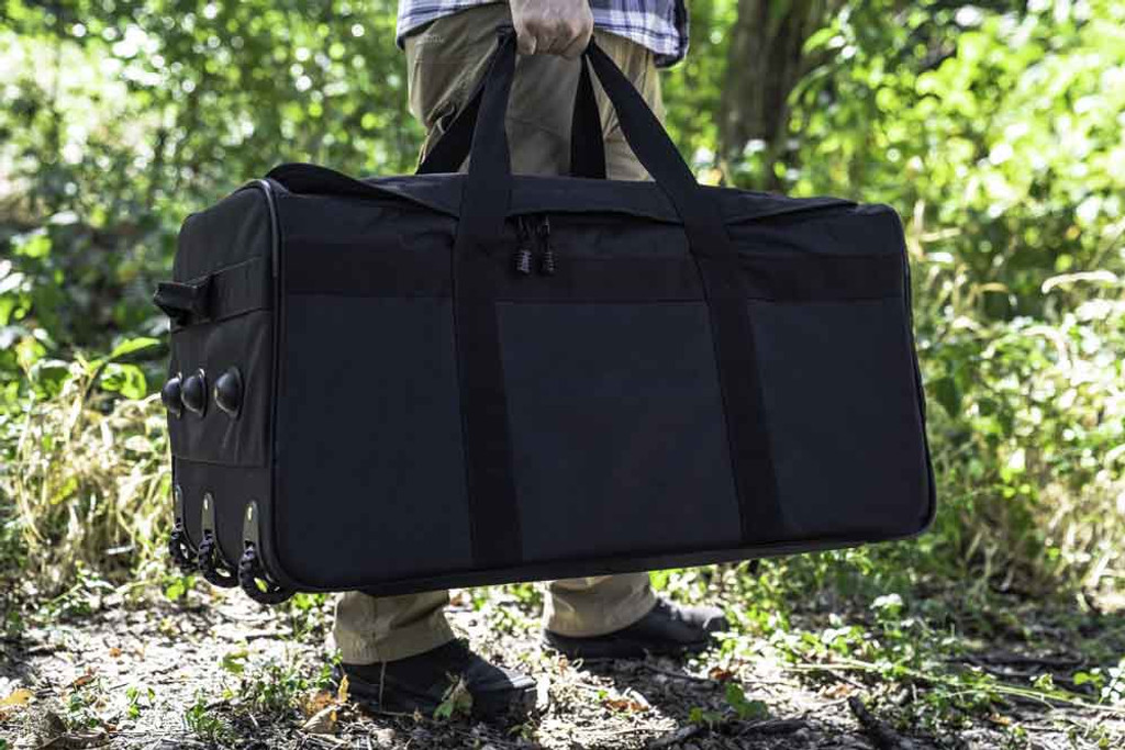 Black Buffalo Duffel carried as a duffel outdoors.