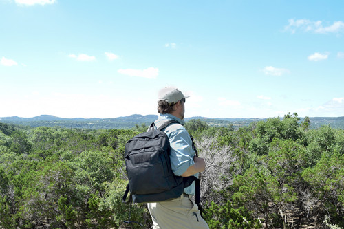 Utility Backpack in black worn hiking.