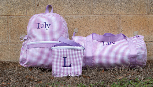 Lilac Gingham Backpack, Duffel, and Snack Square Set with Lily monogrammed in dark purple letters.
