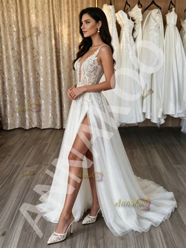 Low V-back detail on a lace appliqué A-line wedding dress
