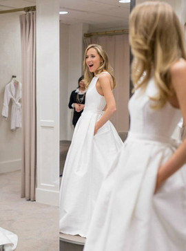 A-Line Round Neck Criss Cross Satin Wedding Dress with Bowknot Pockets