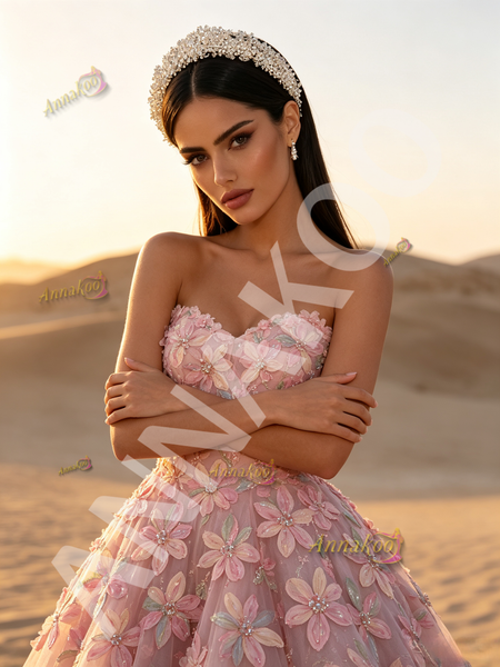 Floral beaded detail on pink tulle prom dress