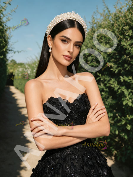 Close-up of the delicate flower and sequin beading embellishment on the sweetheart bodice of a tulle prom dress.