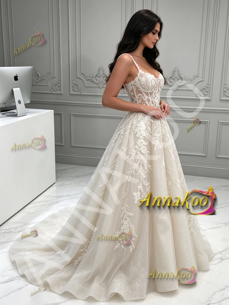 Side view of bohemian spaghetti strap lace and tulle A-line wedding dress