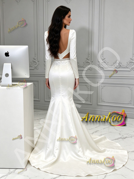 Back view of open back long sleeve satin mermaid bridal dress with train