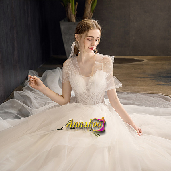 Shop 2021 Beading Appliques Lace Up White Tulle Chapel Train A Line Wedding Dress From Annakoo