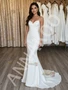 Deep V-neck spaghetti strap satin wedding dress showcasing the body-skimming trumpet silhouette.