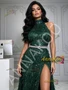 Close-up of dark green halter bodice and cinched waistline with glittering sparkle fabric
