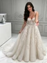 Ivory spaghetti strap A-line tulle wedding dress with lace appliqués front view