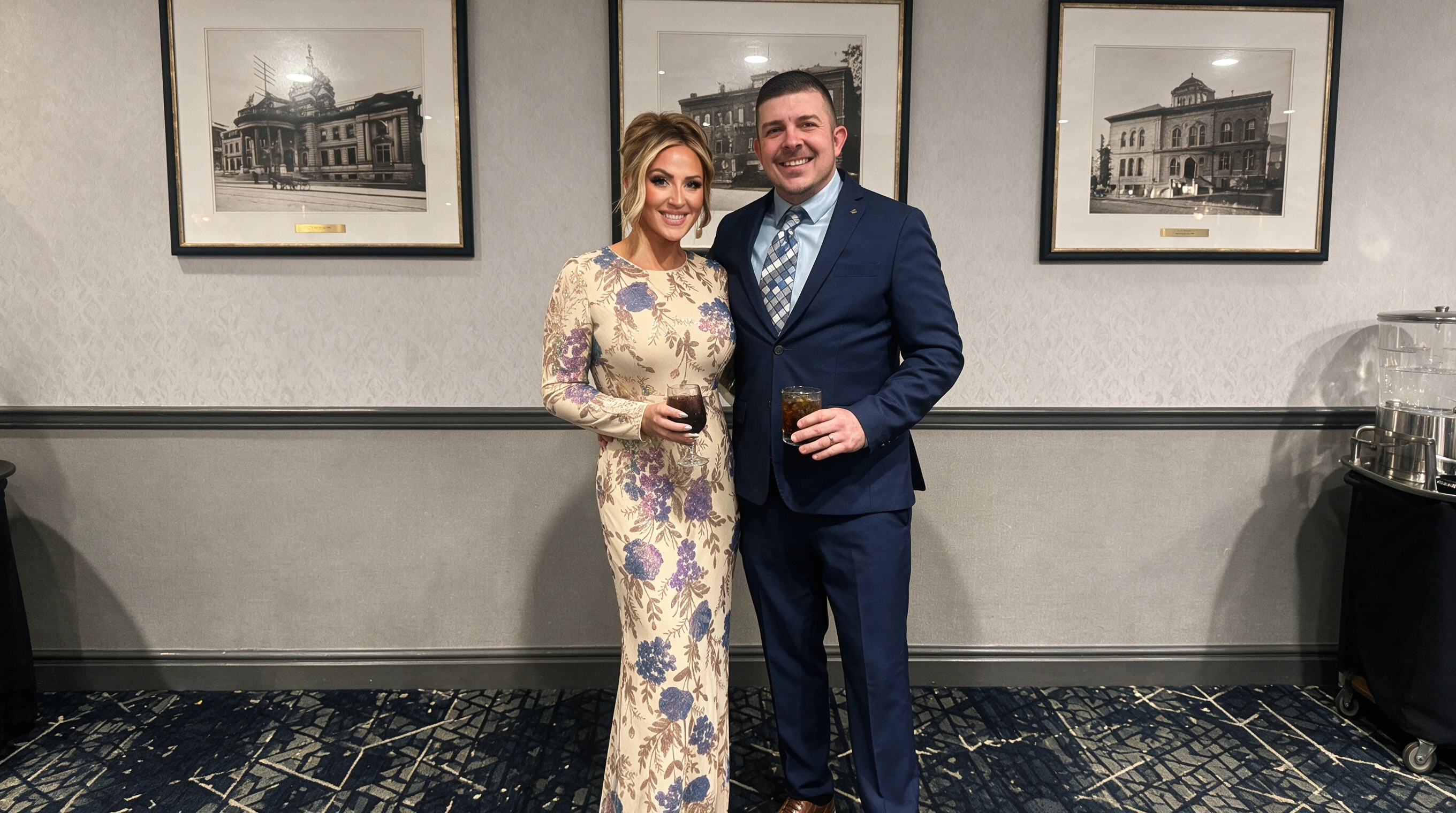 Woman wearing a champagne beige floral sequin mermaid gown at an elegant evening gala