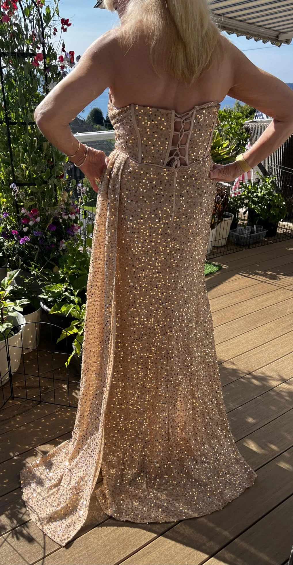 Lace up back on gold sequin gown
