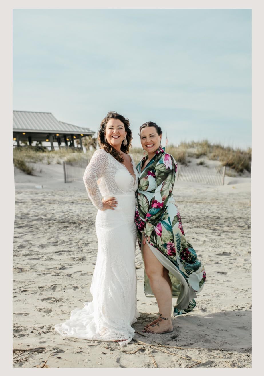 Bride with bridesmaid beach portrait at wedding