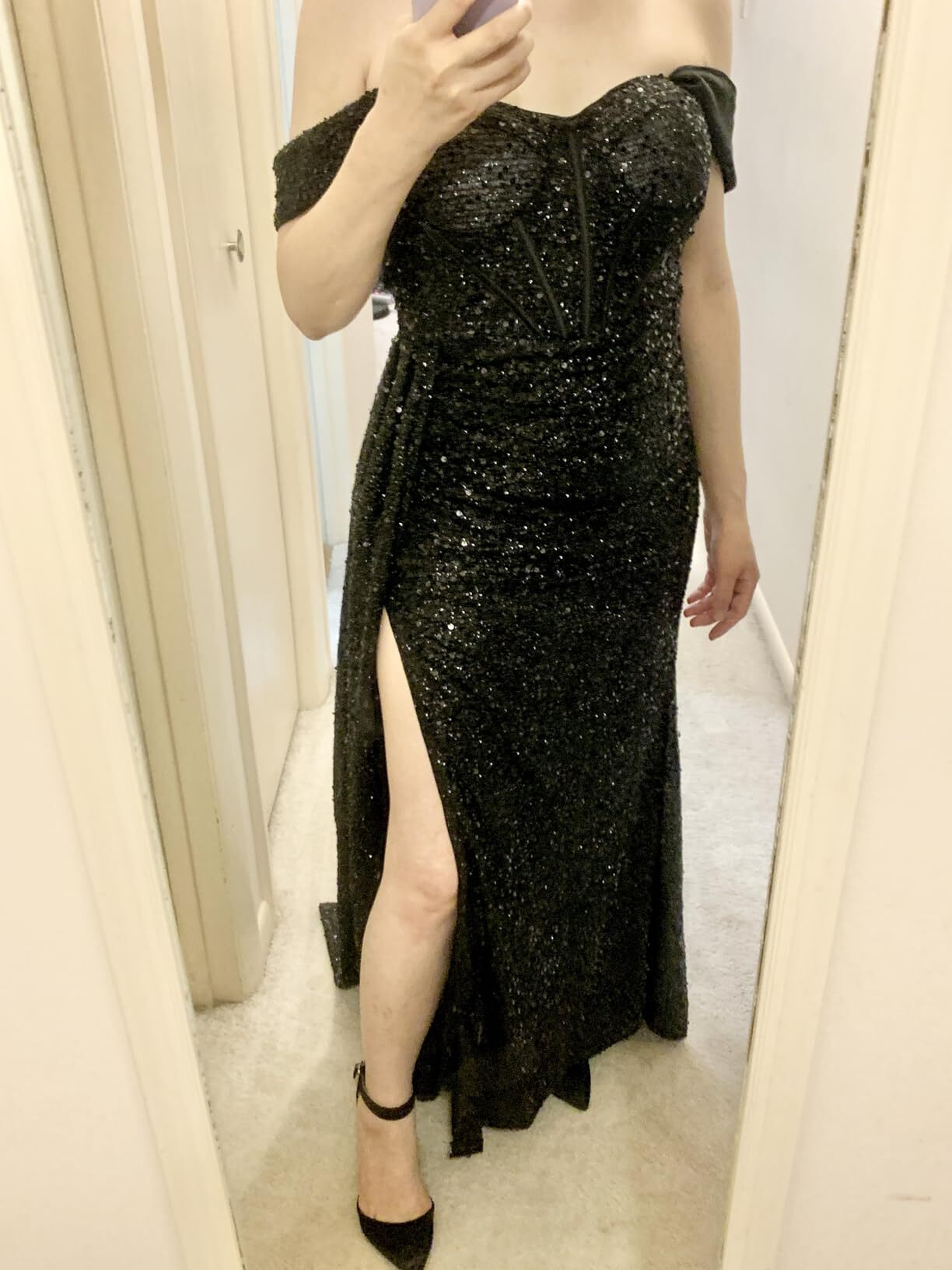 Black off-the-shoulder sequin prom dress with a high side slit
