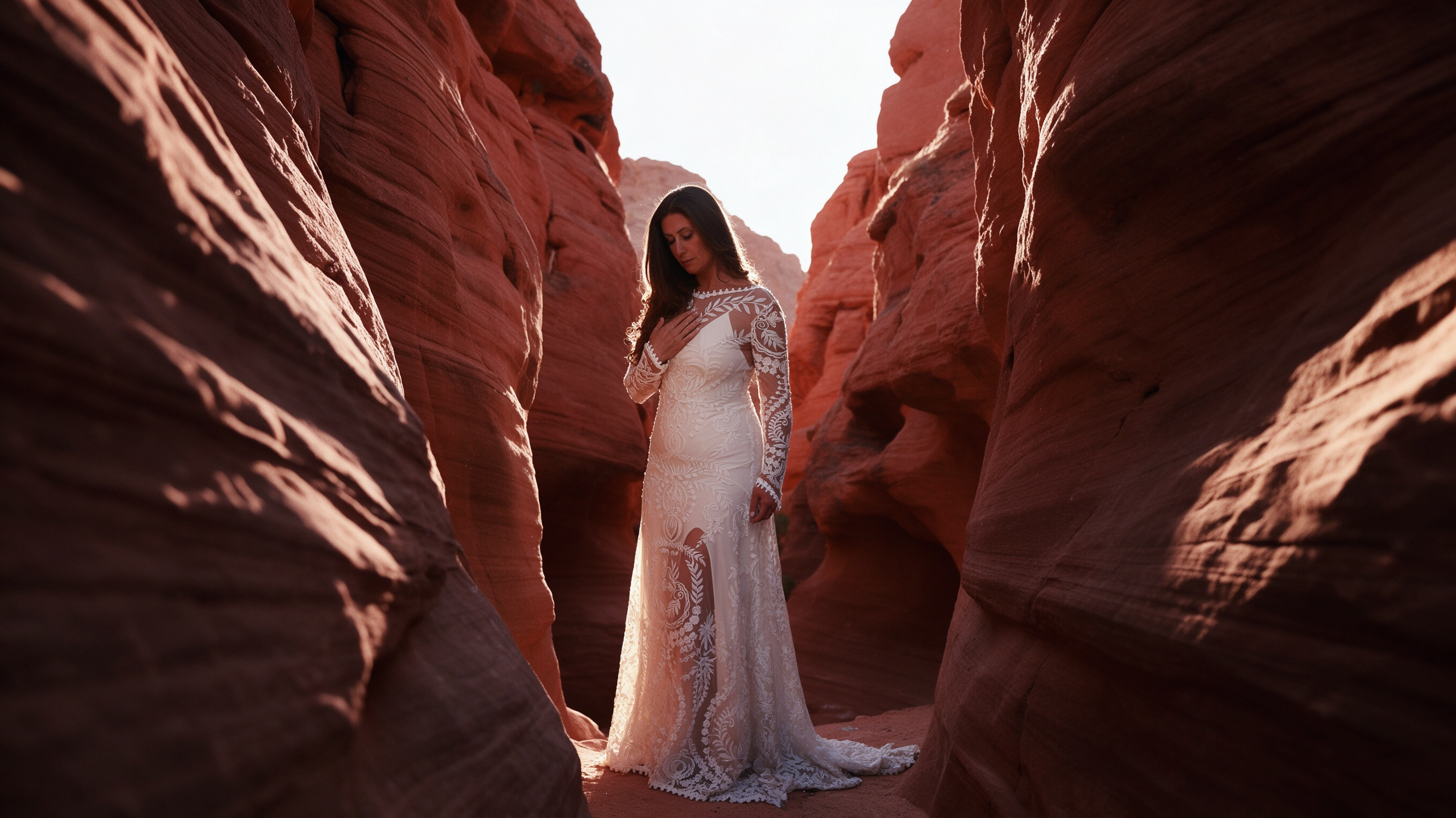 Boho lace wedding dress photographed between red rock formations