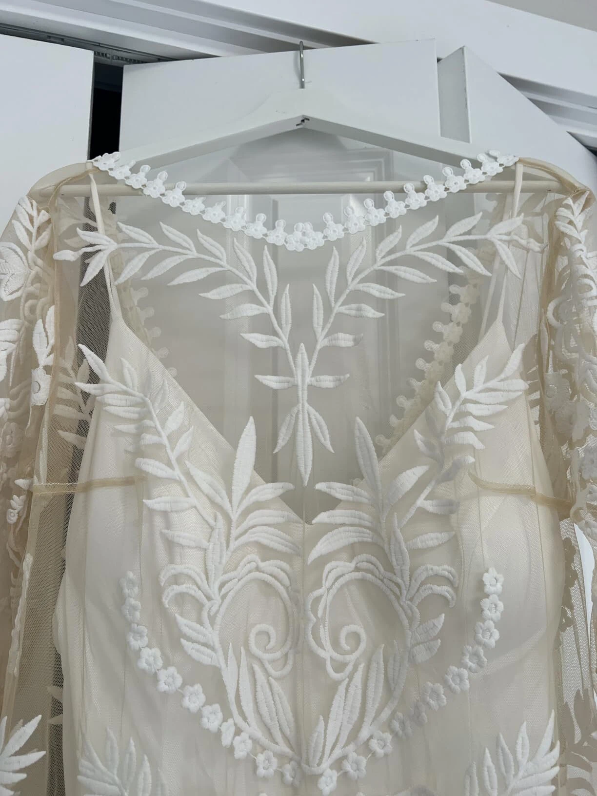 Botanical lace closeup on long sleeve boho wedding dress
