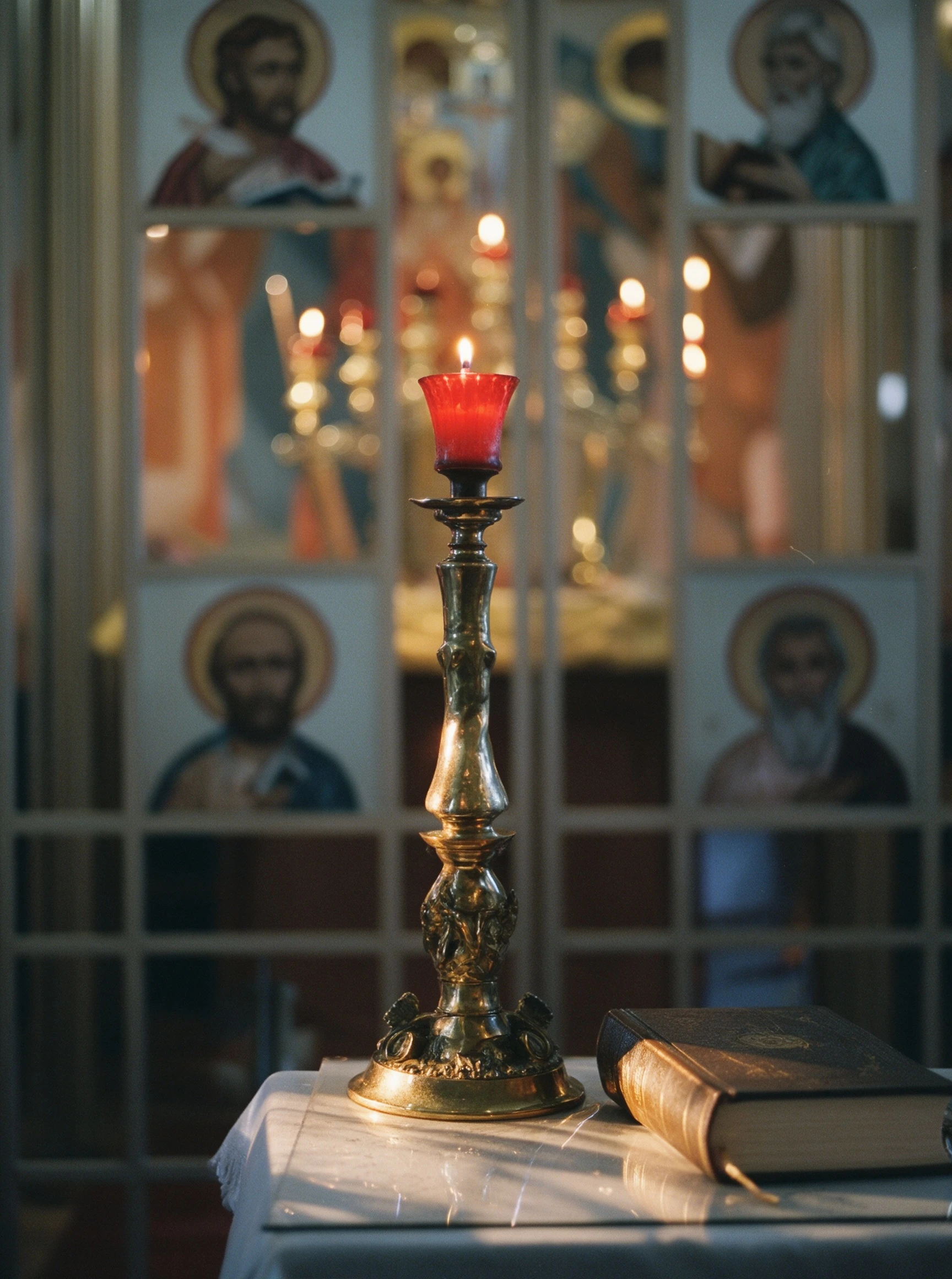 Candle glow beneath painted church icons before Lauren's wedding ceremony