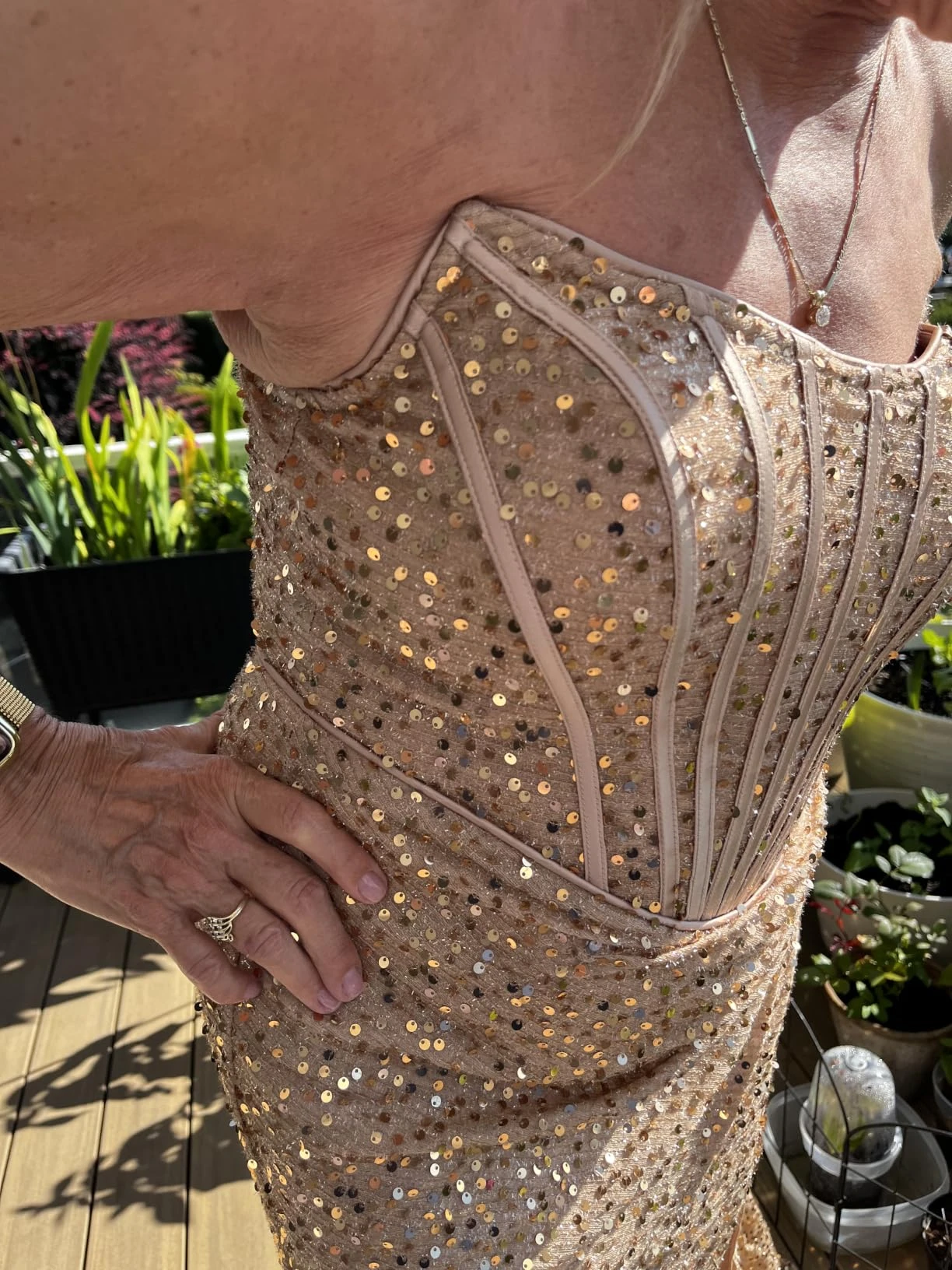 Boning detail on gold sequin corset bodice