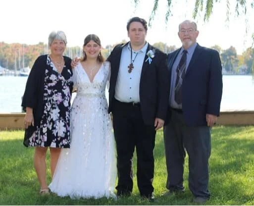 Family waterside portrait from Lauren's October wedding