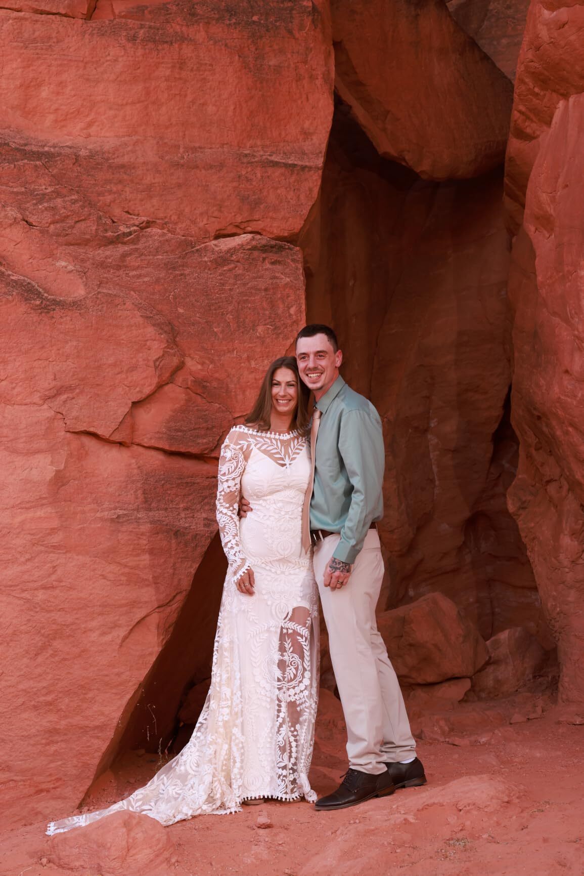 Fit and flare lace wedding dress inside a red rock cave at Valley of Fire