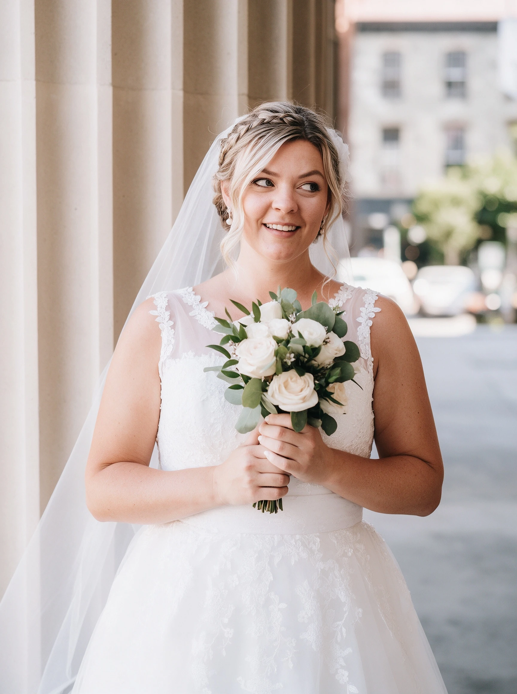 Holding white roses in my short lace wedding dress