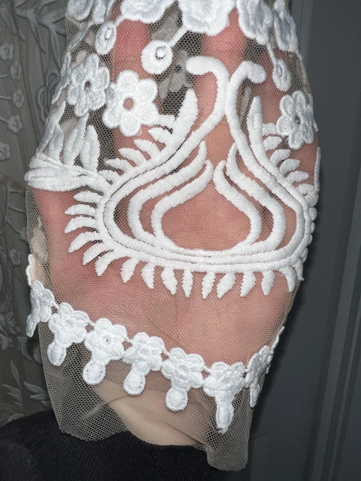 Intricate botanical lace detail on boho wedding dress