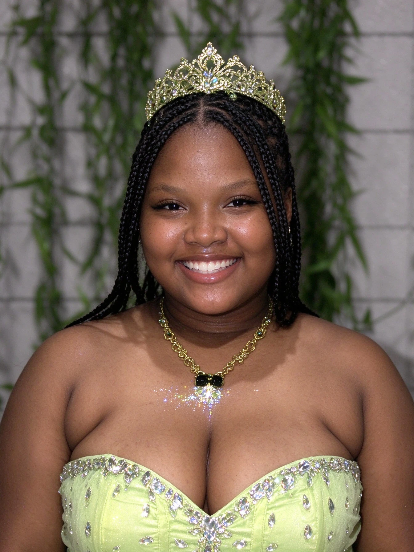 Lime green Sweet 16 gown with rhinestone sweetheart bodice and gold necklace