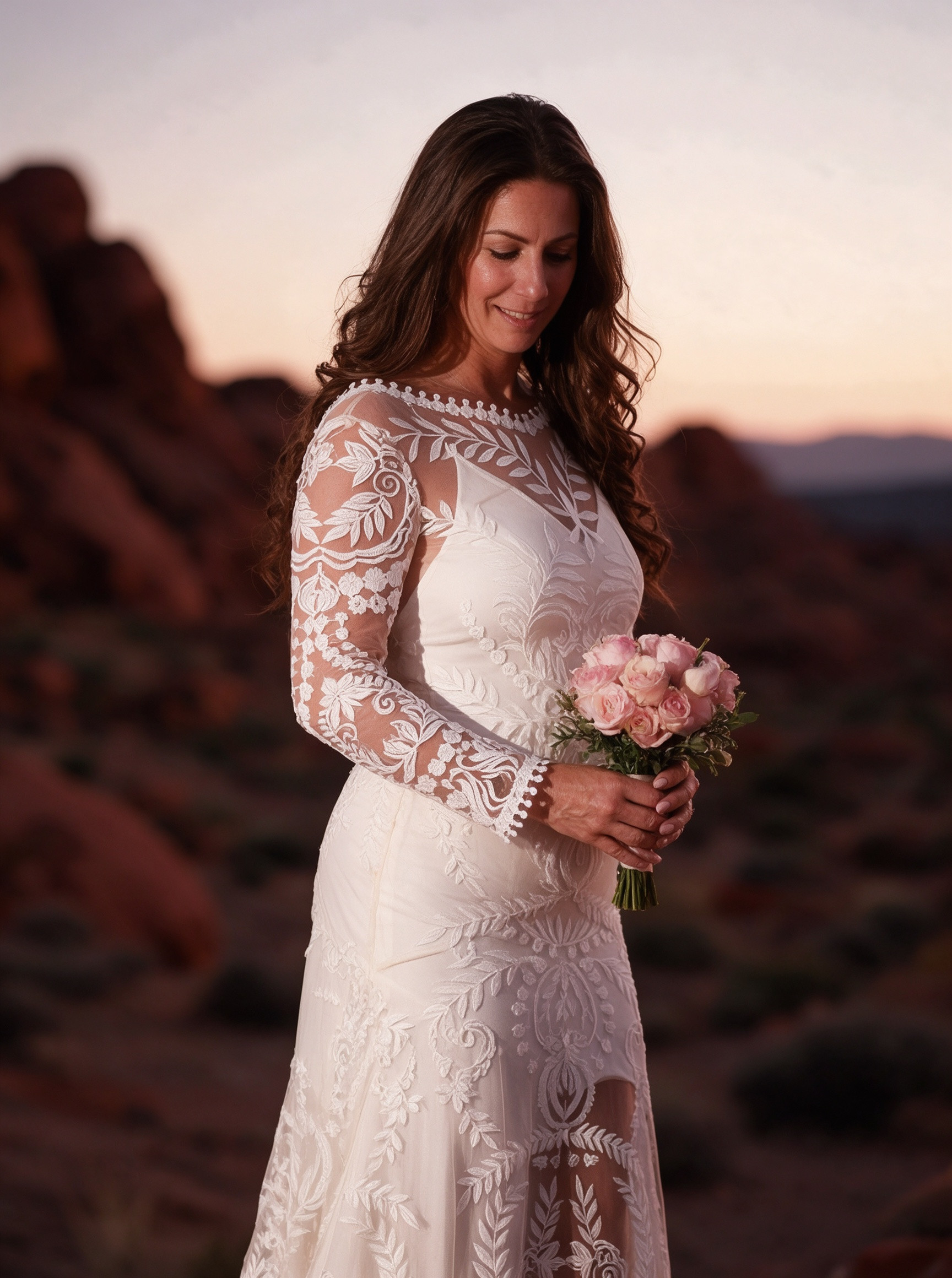 Long sleeve lace wedding dress photographed during desert sunset