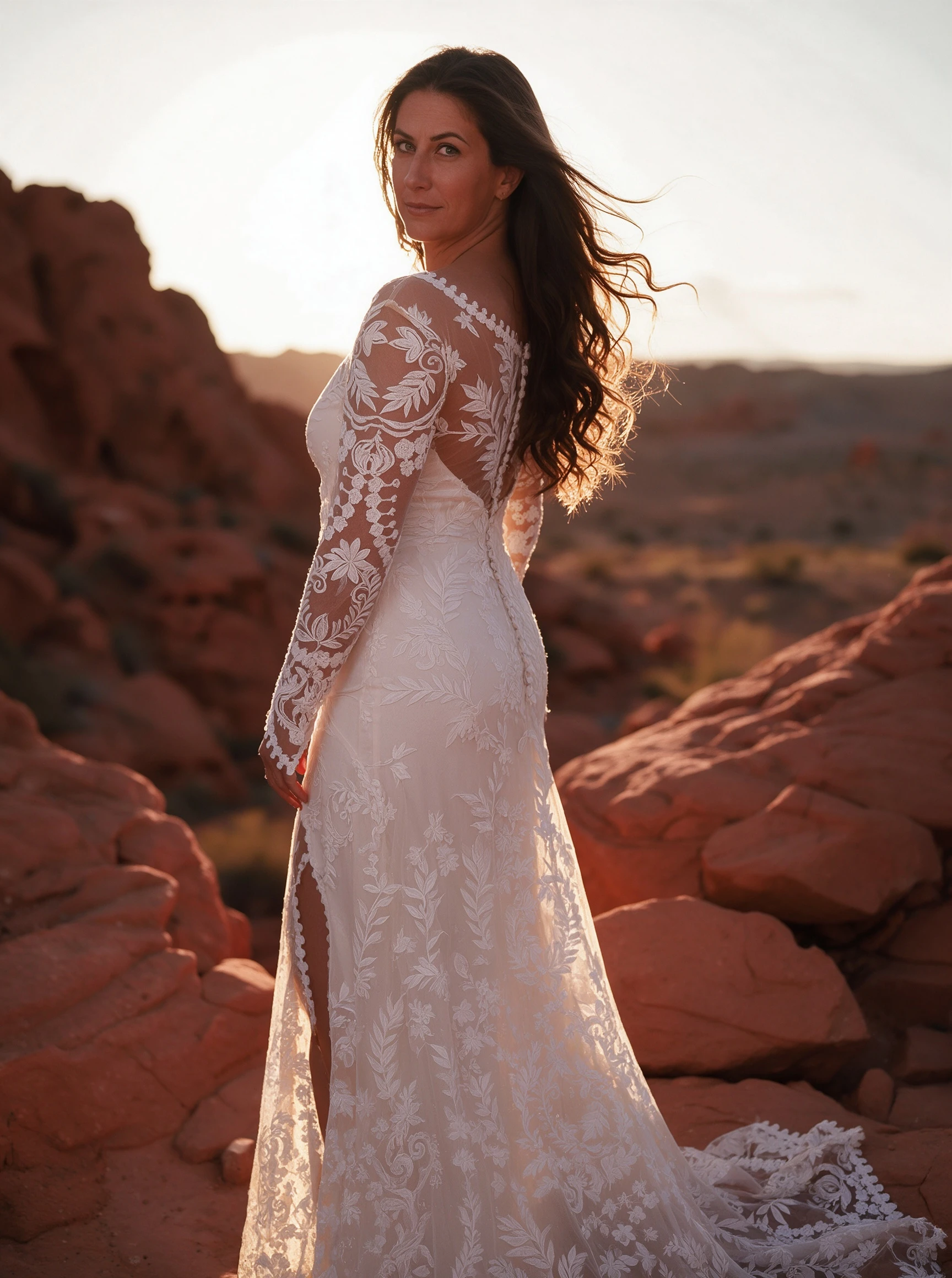 Long sleeve lace wedding dress with side slit for movement in desert setting