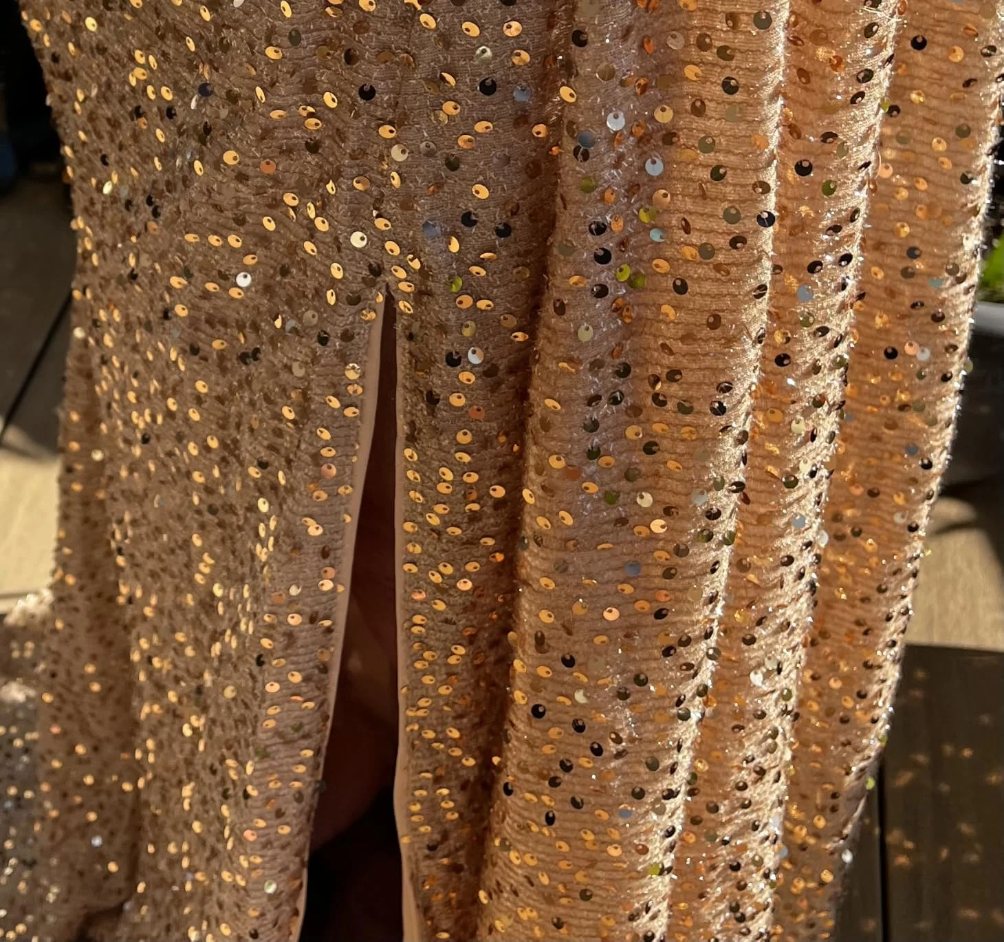 Gold sequin stitching detail on formal gown