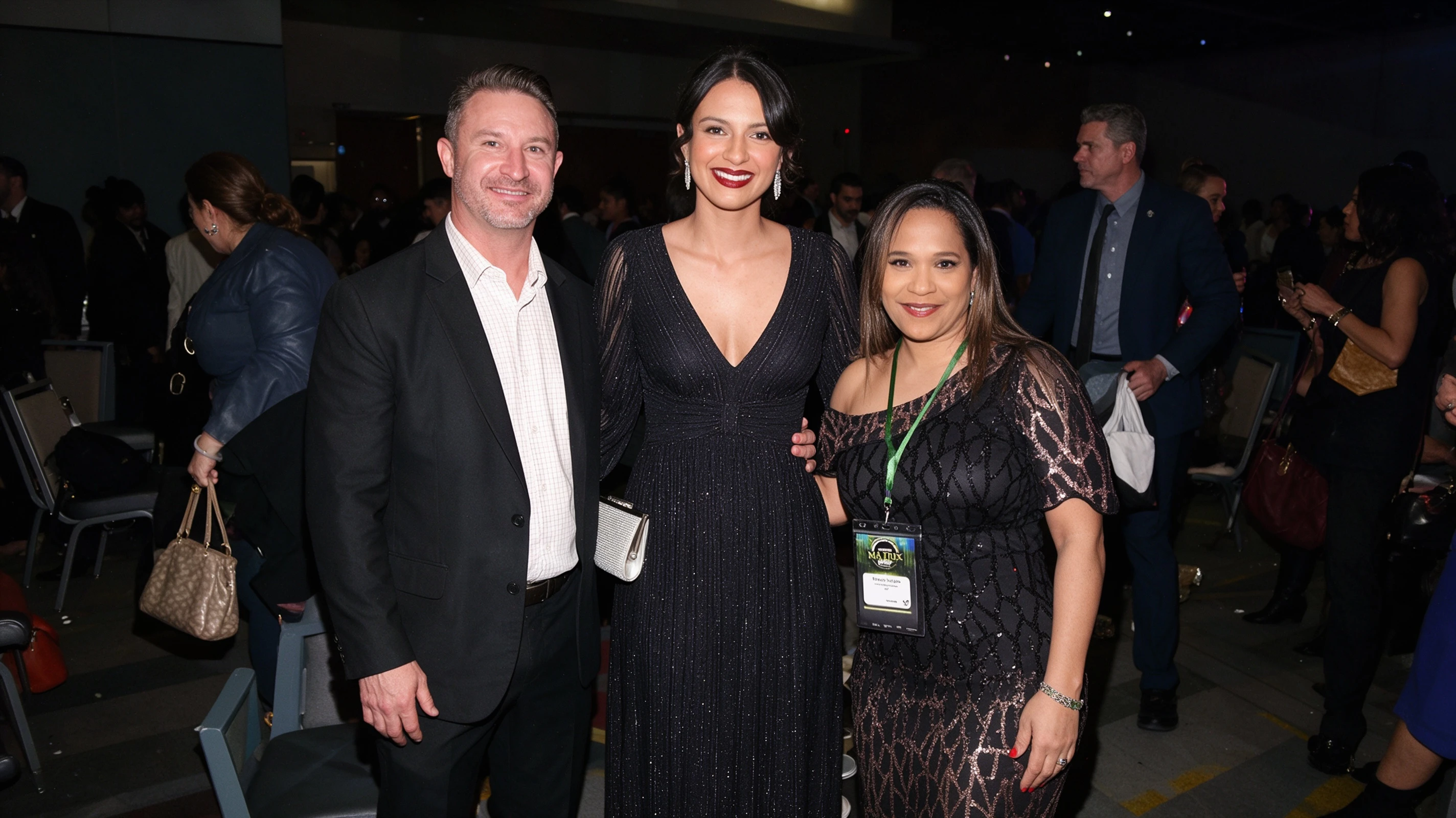 Woman wearing a black sequin evening gown with friends at a San Antonio gala