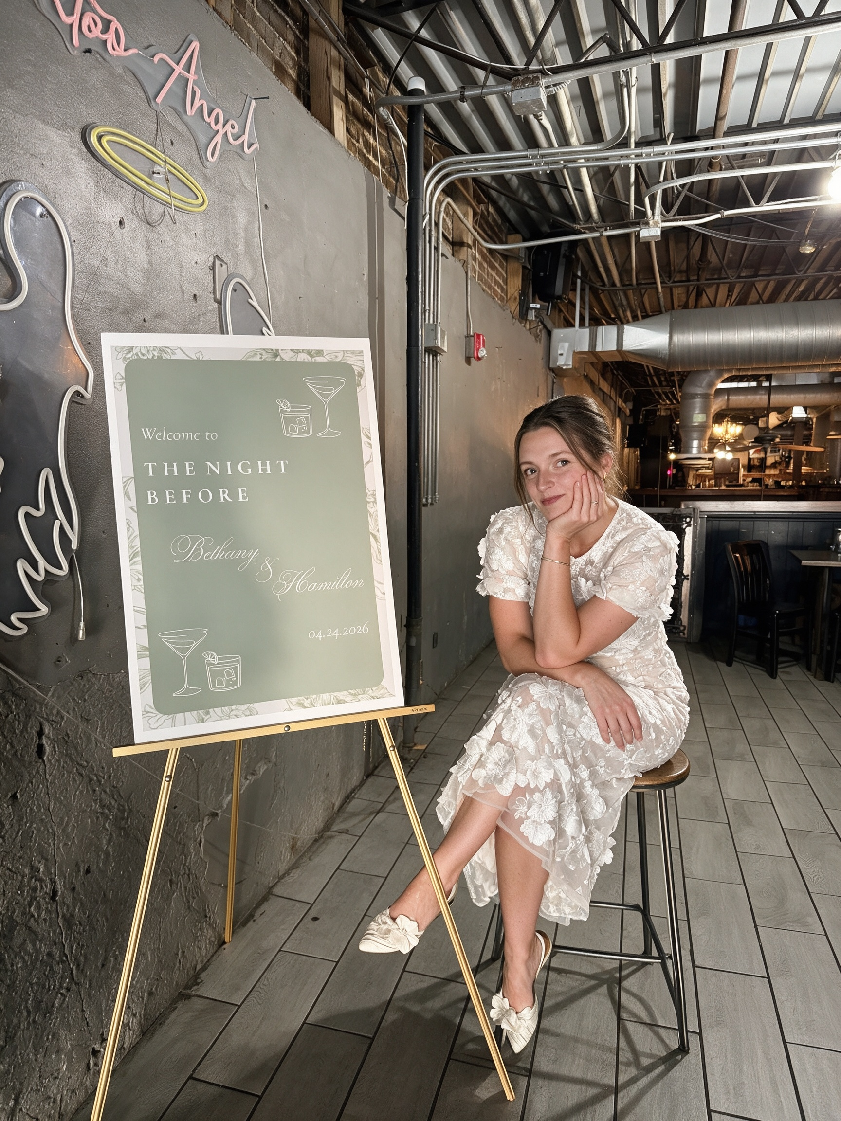Sitting comfortably in my floral lace rehearsal dinner dress