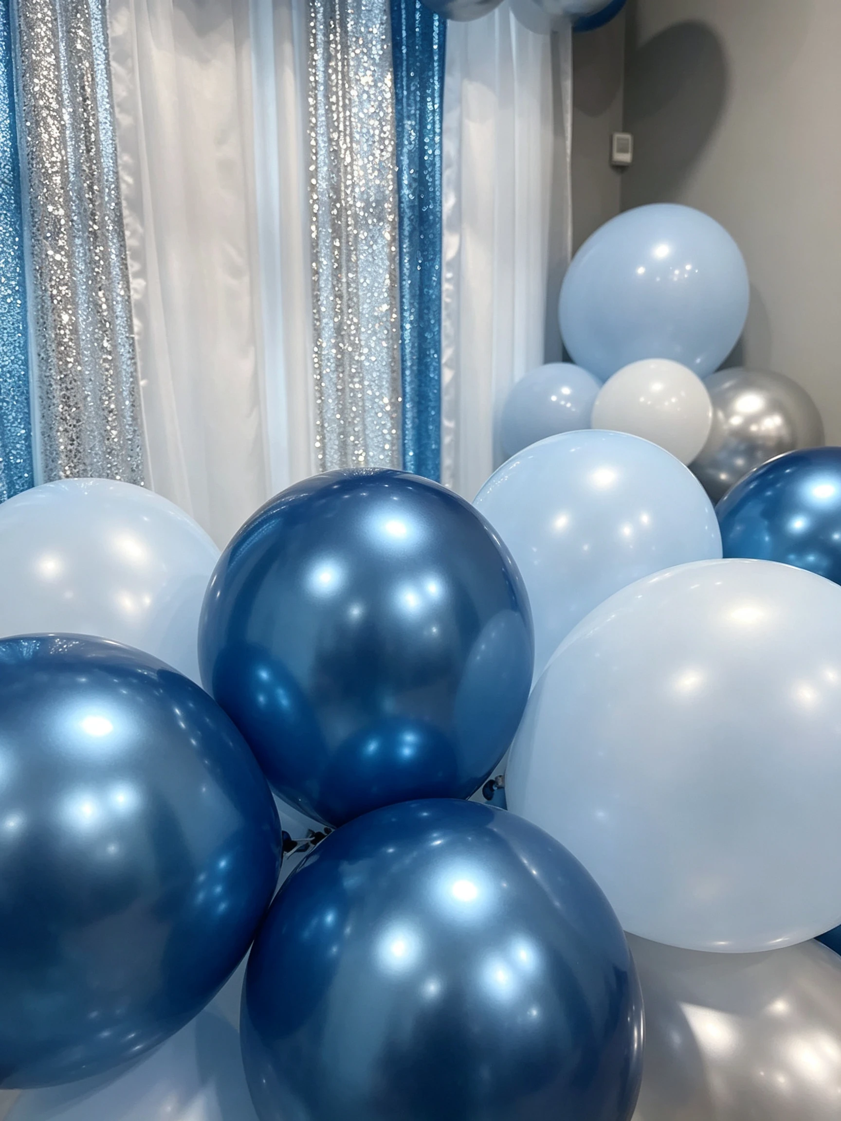 Metallic blue and silver balloon arch for Sweet 16 party