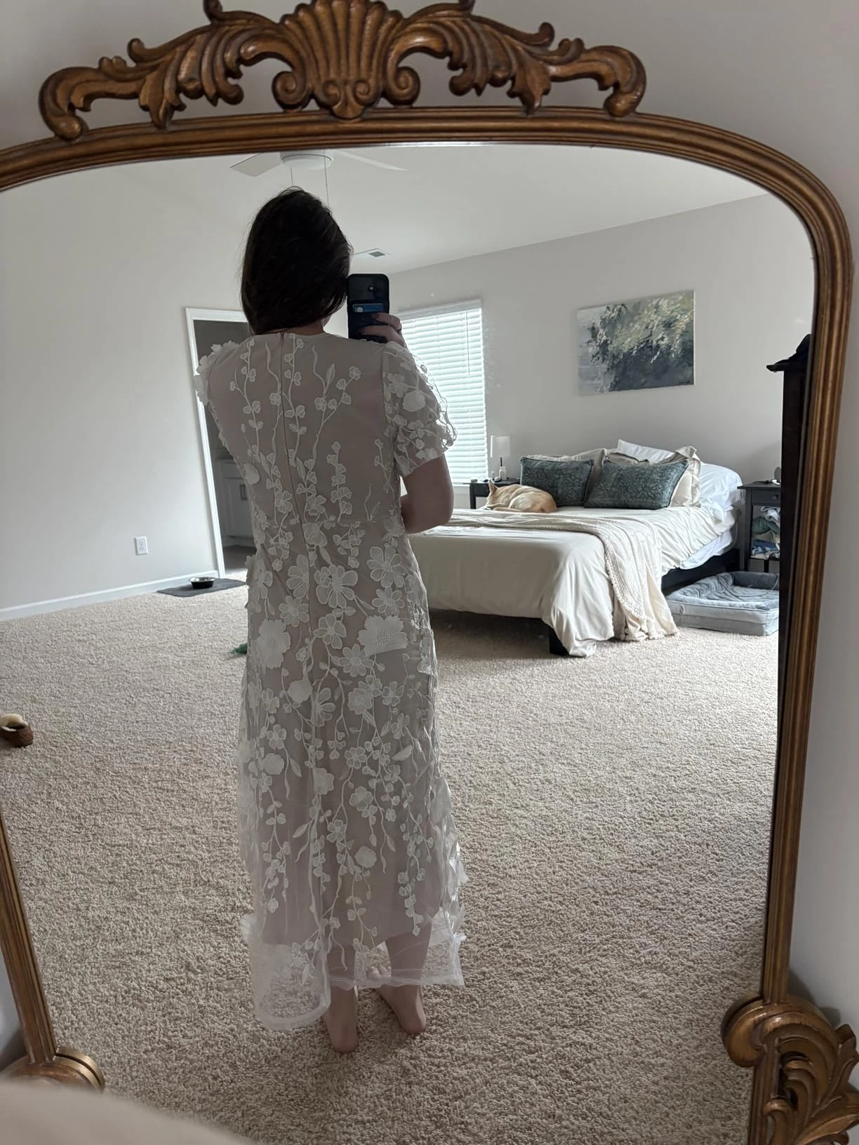 Back view in a mirror showing the fit of my white lace midi dress