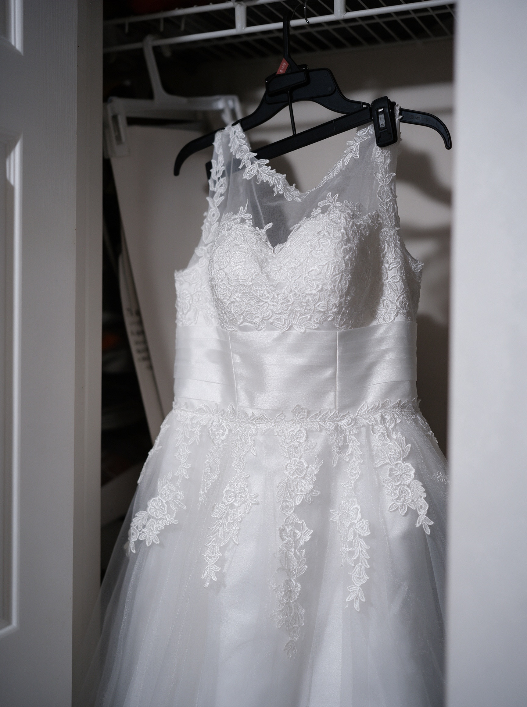 My affordable short lace wedding dress hanging at home before the wedding