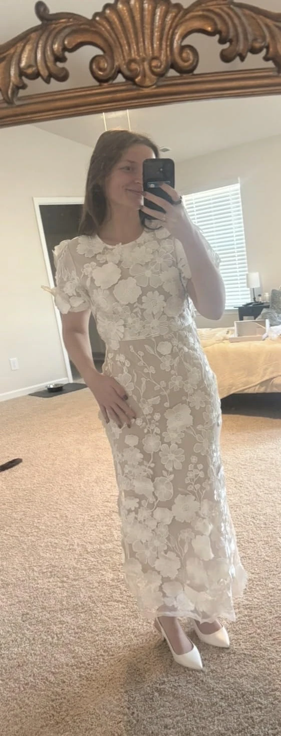 Full length mirror selfie showing the first try on of a white floral lace midi dress