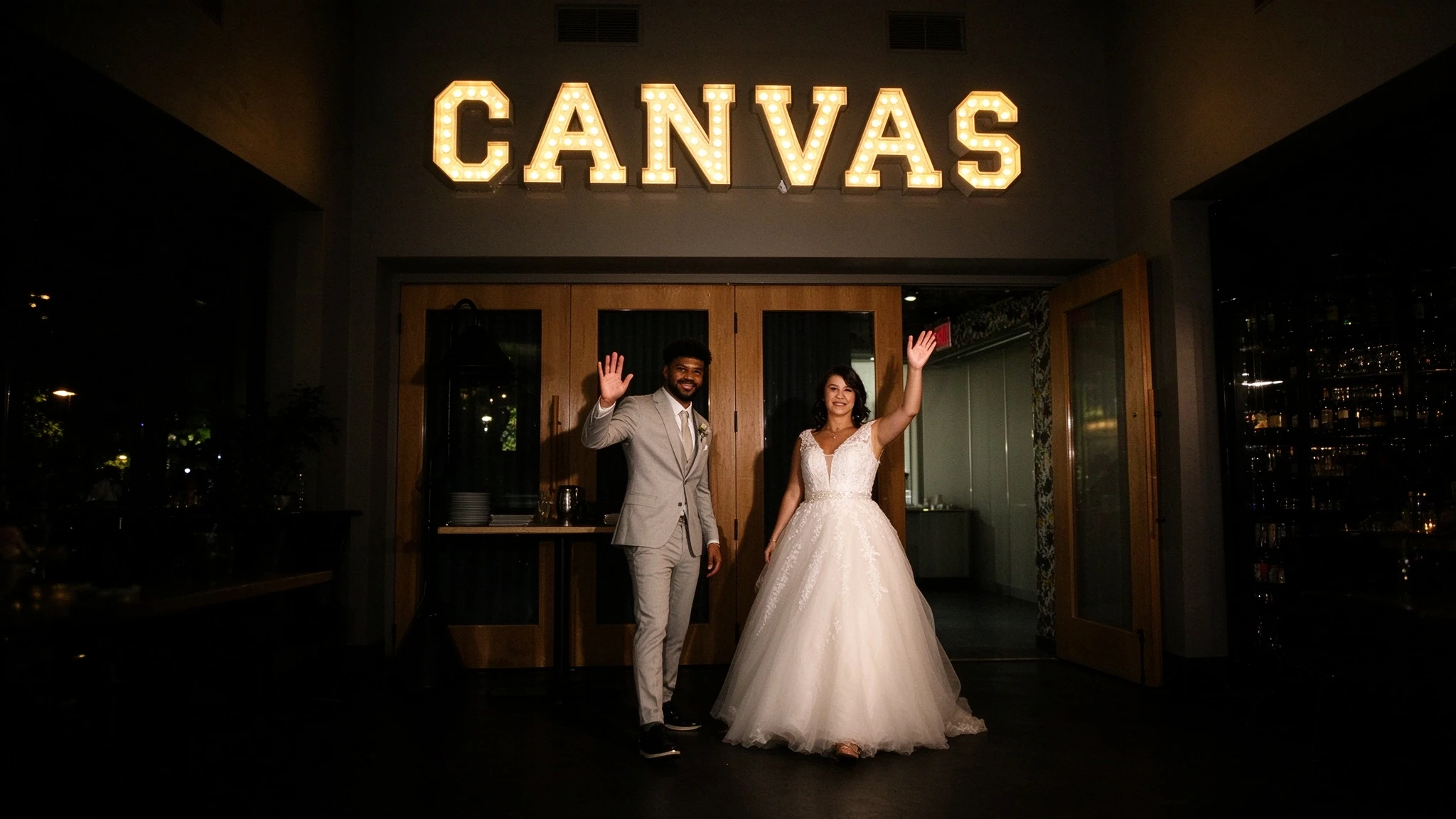 Bride entering Canvas Restaurant in a flowing lace A-line wedding gown