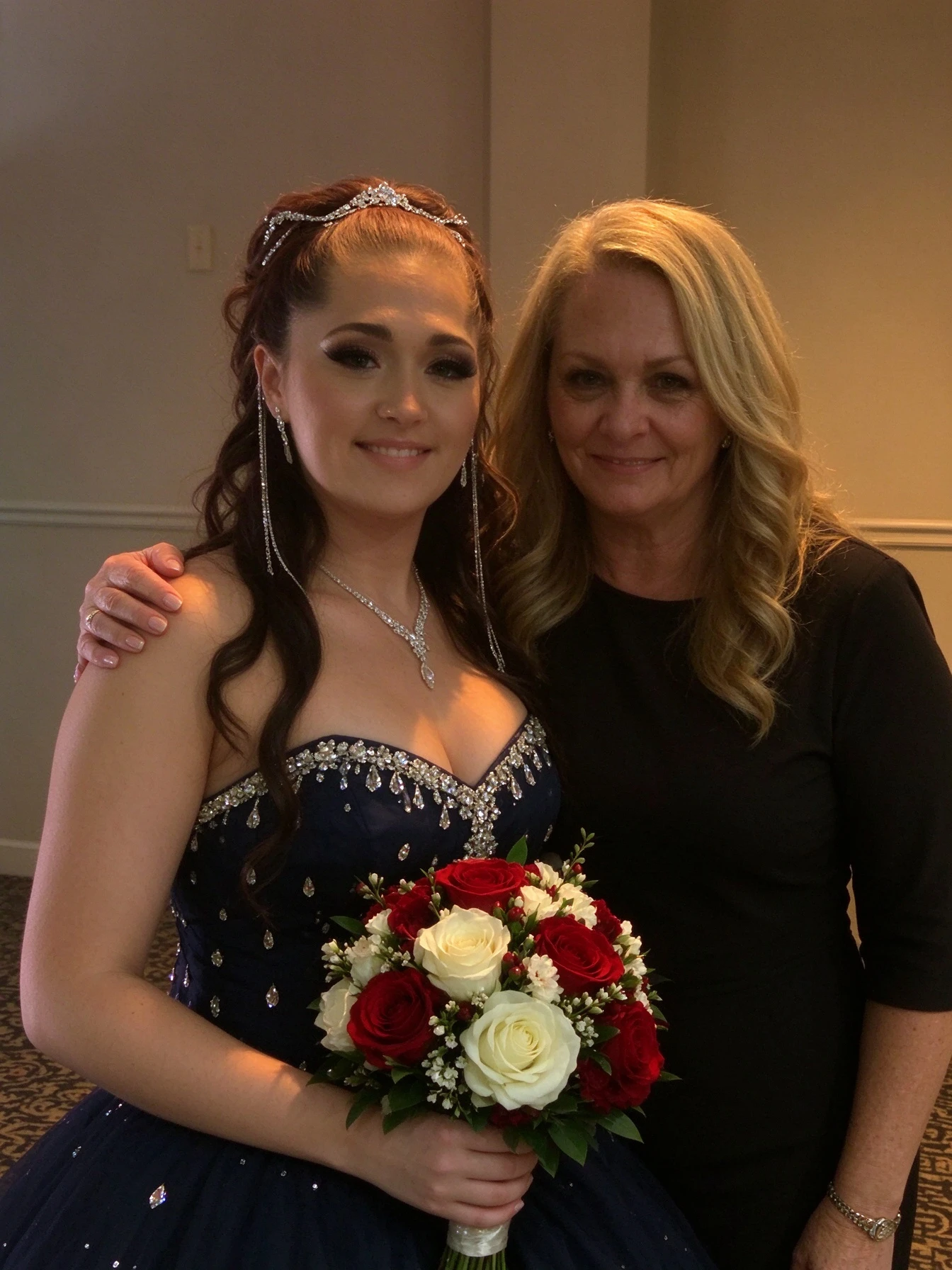 Bride and maid of honor holding wedding bouquets