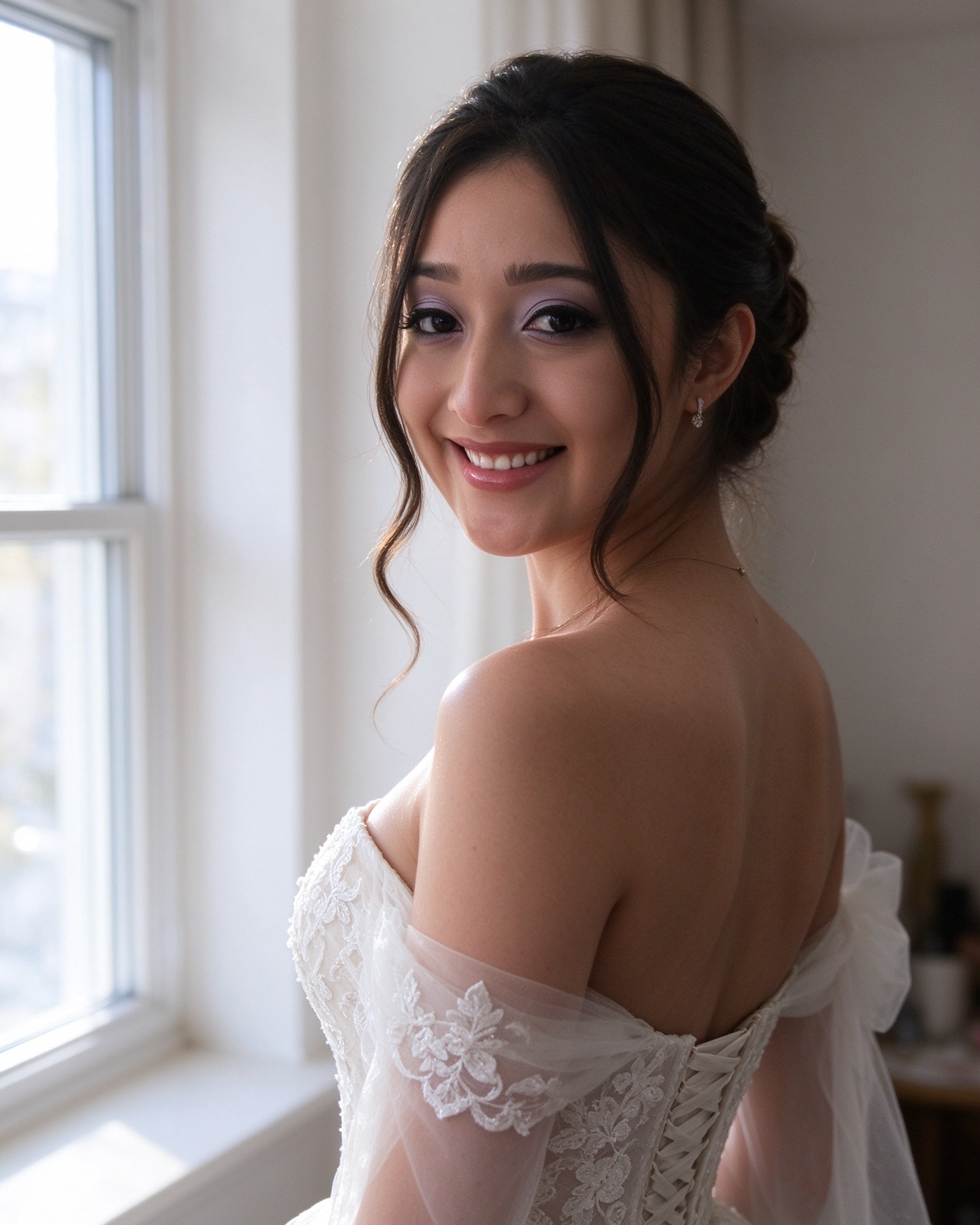 Bride wearing an off the shoulder tulle sleeve in soft window light