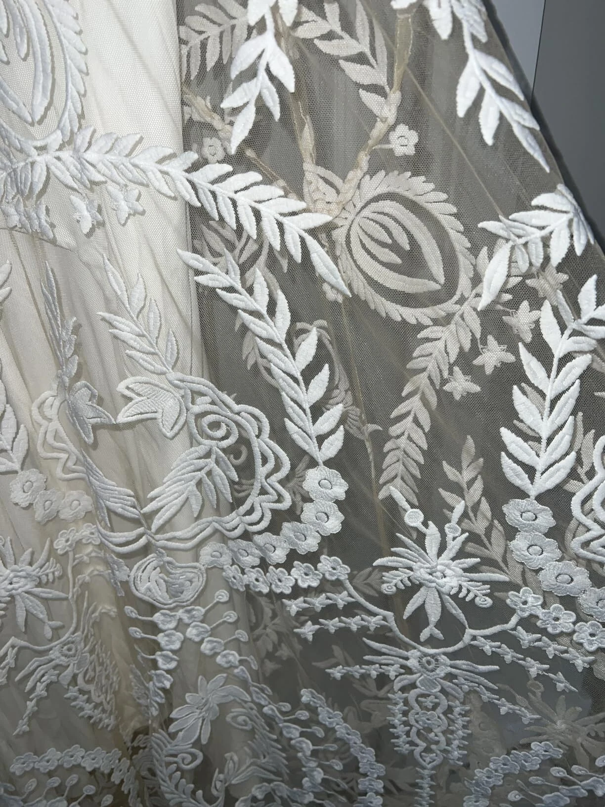 Ornate floral lace pattern on custom fit wedding dress