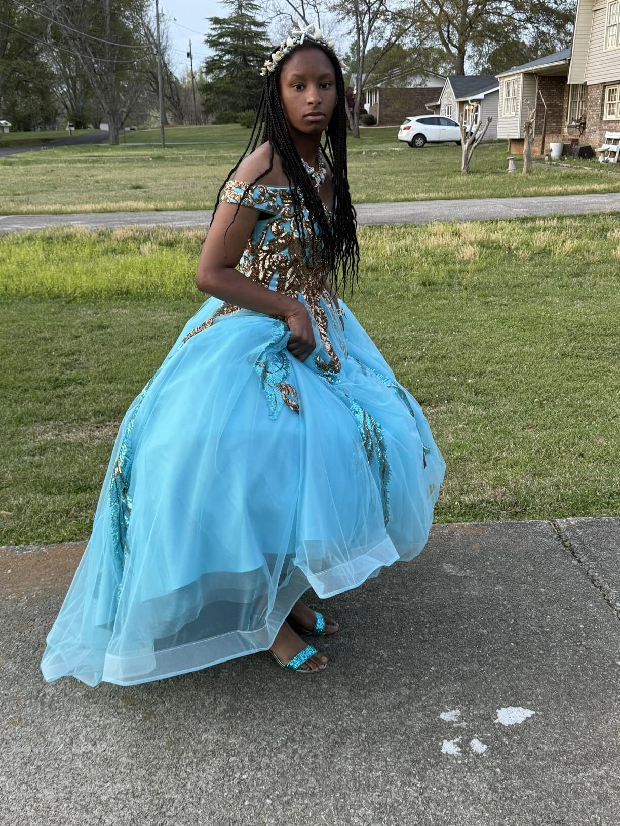Turquoise prom gown moving outdoors with full tulle skirt