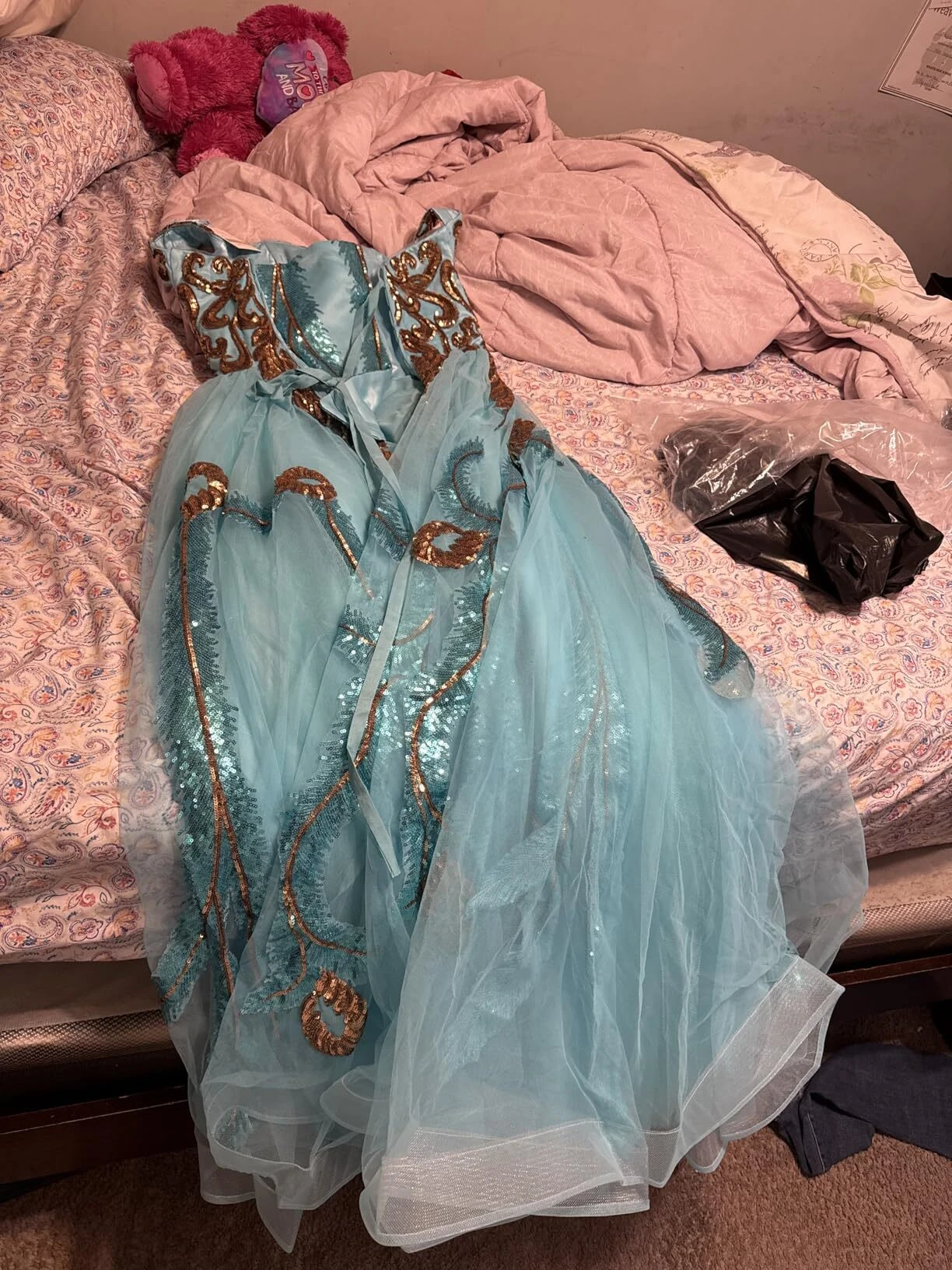 Detailed gold sequin bodice on a turquoise formal prom gown