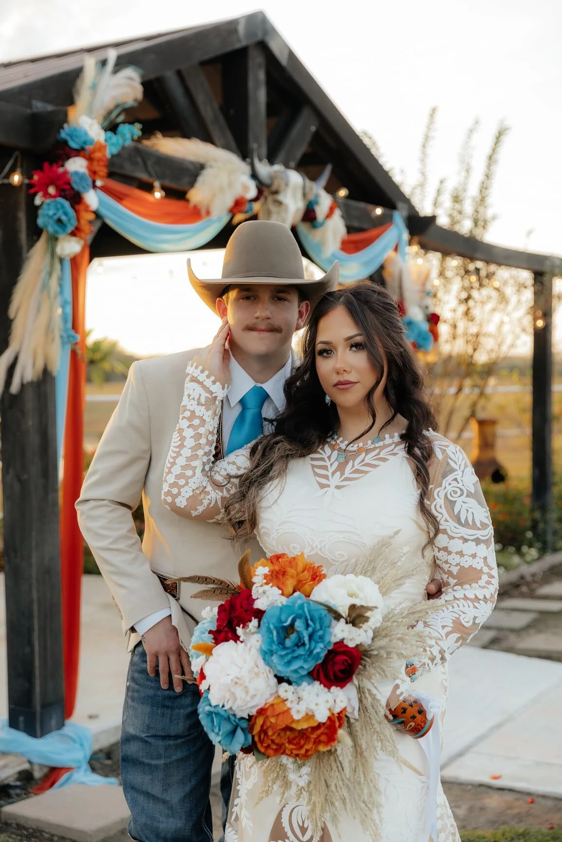 Ranch wedding portrait of bride wearing stunning lace wedding dress