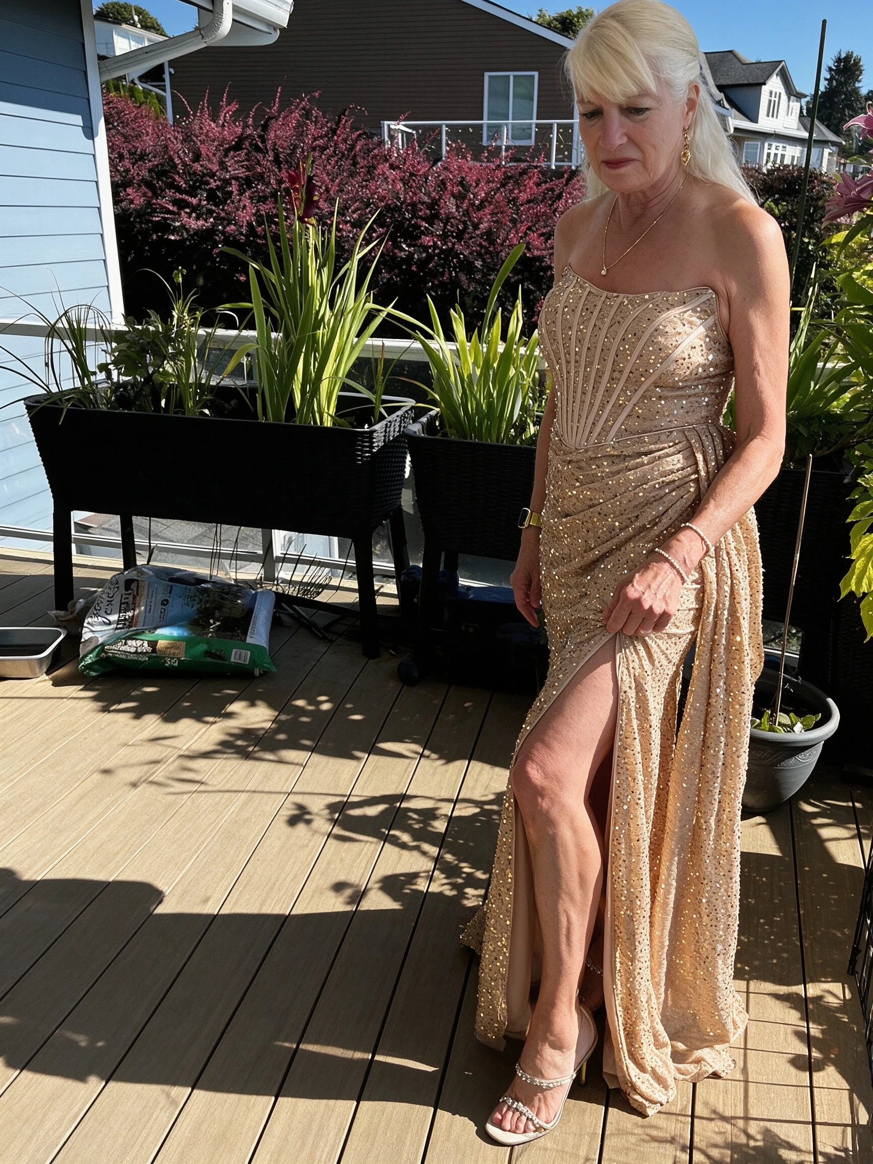 Rear view of gold sequin corset gown