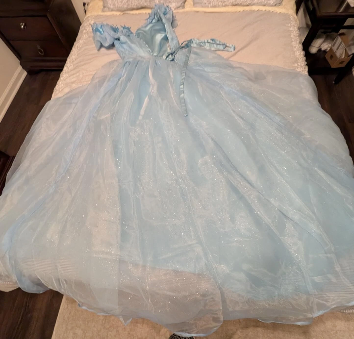 Sky blue glitter tulle ball gown fabric flat lay