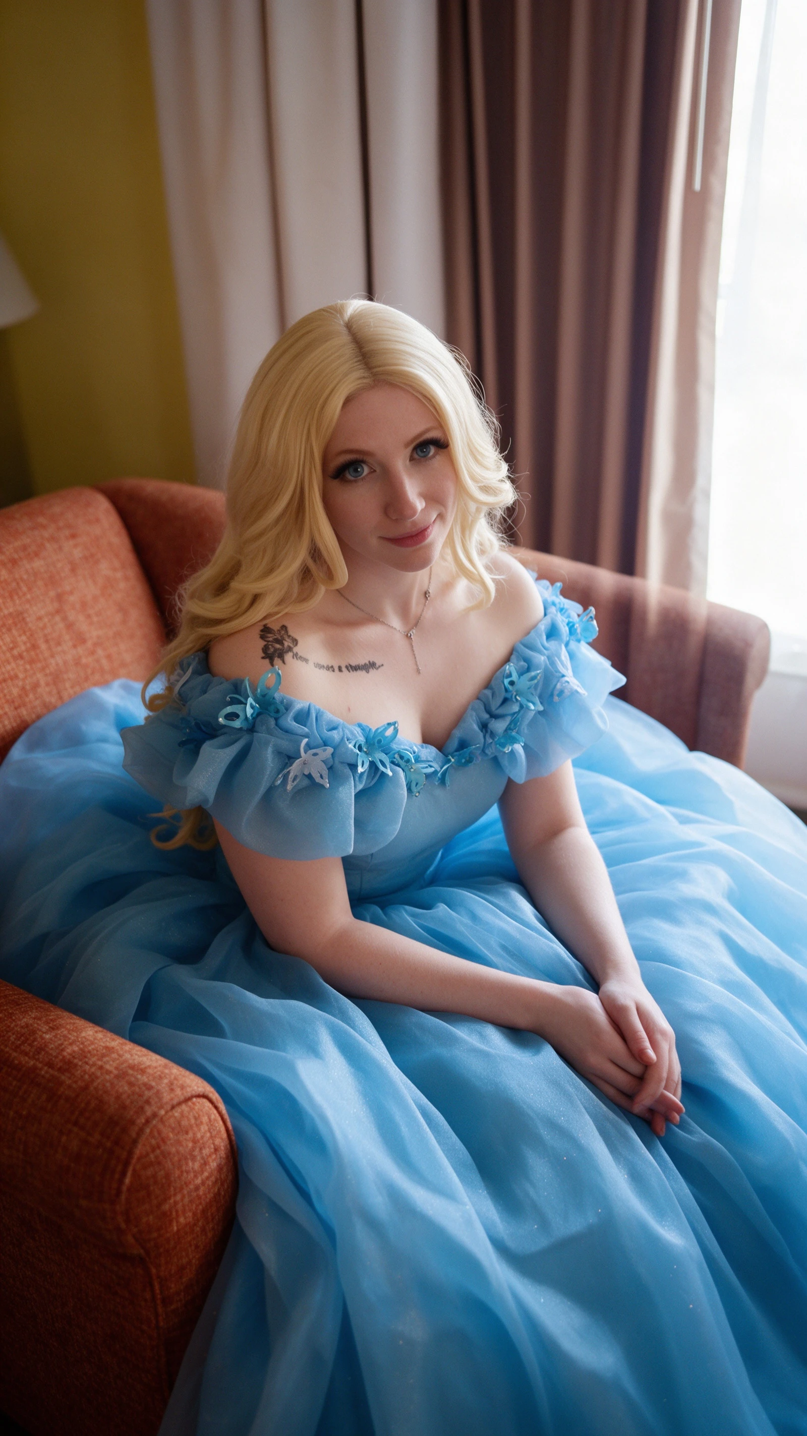 Sweet 16 blue ball gown with butterfly bodice seated portrait